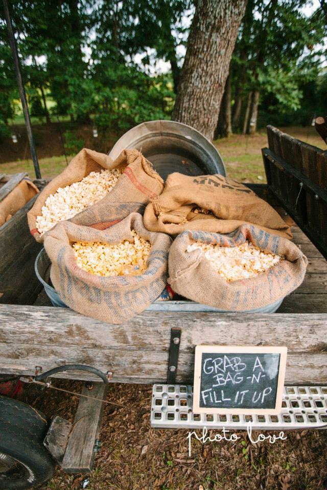 Photo Love Photography , from Ashley + Derrick 's wedding. The popcorn wagon is always a big hit!