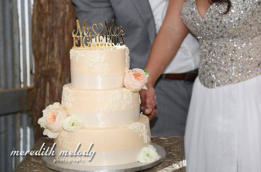 Meredith Melody Photography . Ashley + Ivan 's Puerto Rican extravaganza was beyond spectacular, and their cake topper was no different! This option is simple, yet glamorous, and it looks great atop a simple cake. 