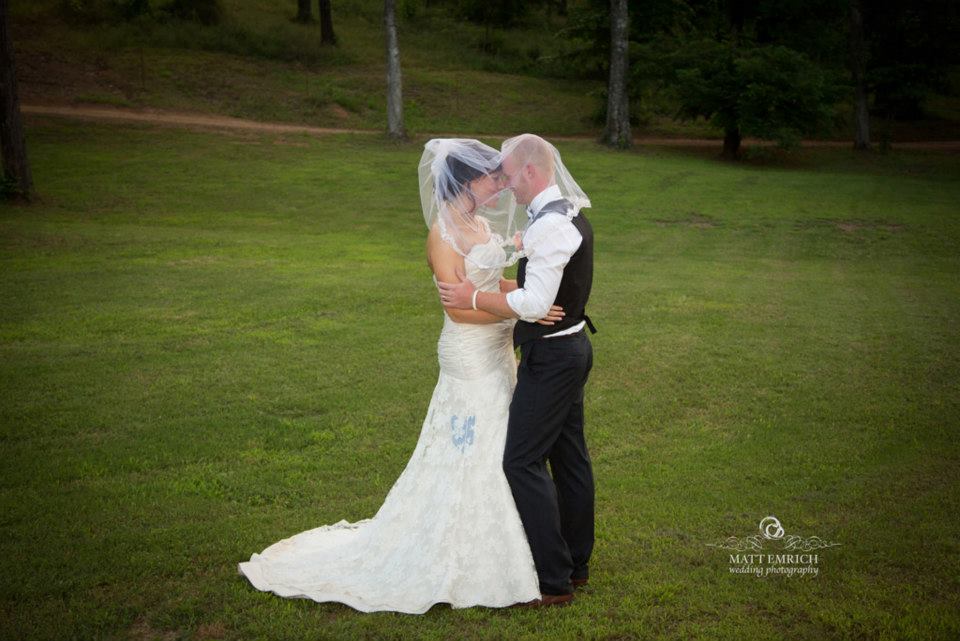 Matt Emrich Photo , from Lyndsey + Brad 's wedding. See that blue heart sewn into Lyndsey's gorgeous dress? It was from a piece of her great grandfather's shirt. What a special way to honor someone who was such a big part of your story! 