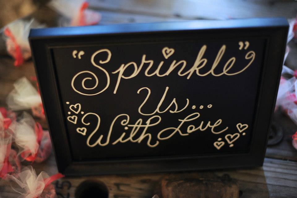 BnBauman Photography , from Hayley + Zach 's wedding. When she got married, Hayley worked at a bakery, so this couple's decor included lots of SWEET things... a candy buffet, glittery shoes for the bride that looked like they were covered in sprinkles (yum), and a sprinkle toss getaway! 