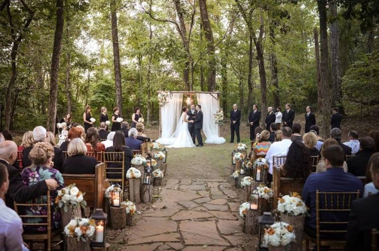 Miles Witt Boyer , from Lauren + Jack 's wedding at The Barn. The aisle lined with lanterns, logs and gorgeous flowers made this dreamy ceremony very fall-appropriate. 