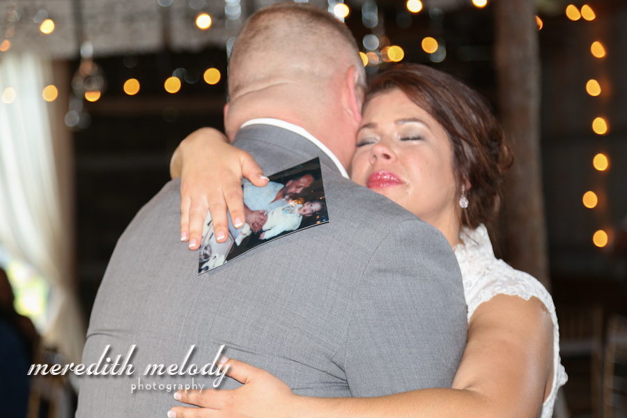 Meredith Melody Photography , from Ashley + Ivan 's wedding. During their father-daughter dance, Ashley's stepdad pulled out a photo of her with her real dad, so she could share the dance with him, too. SO sad, SO sweet!!!