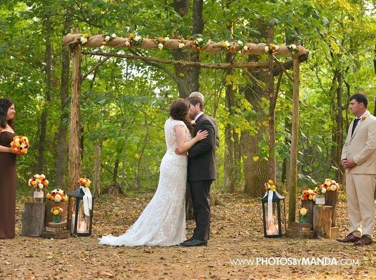 Photos by Manda Leah + Parker 's wedding altar was very simple and minimalist, just like the rest of their wedding details. I love the burlap and small floral arrangements on the top of their altar, as well as the lanterns and wood accents. Their florals were the most gorgeous fall colors! This wedding was one of our most simple and understated, but it was still SO gorgeous! 
