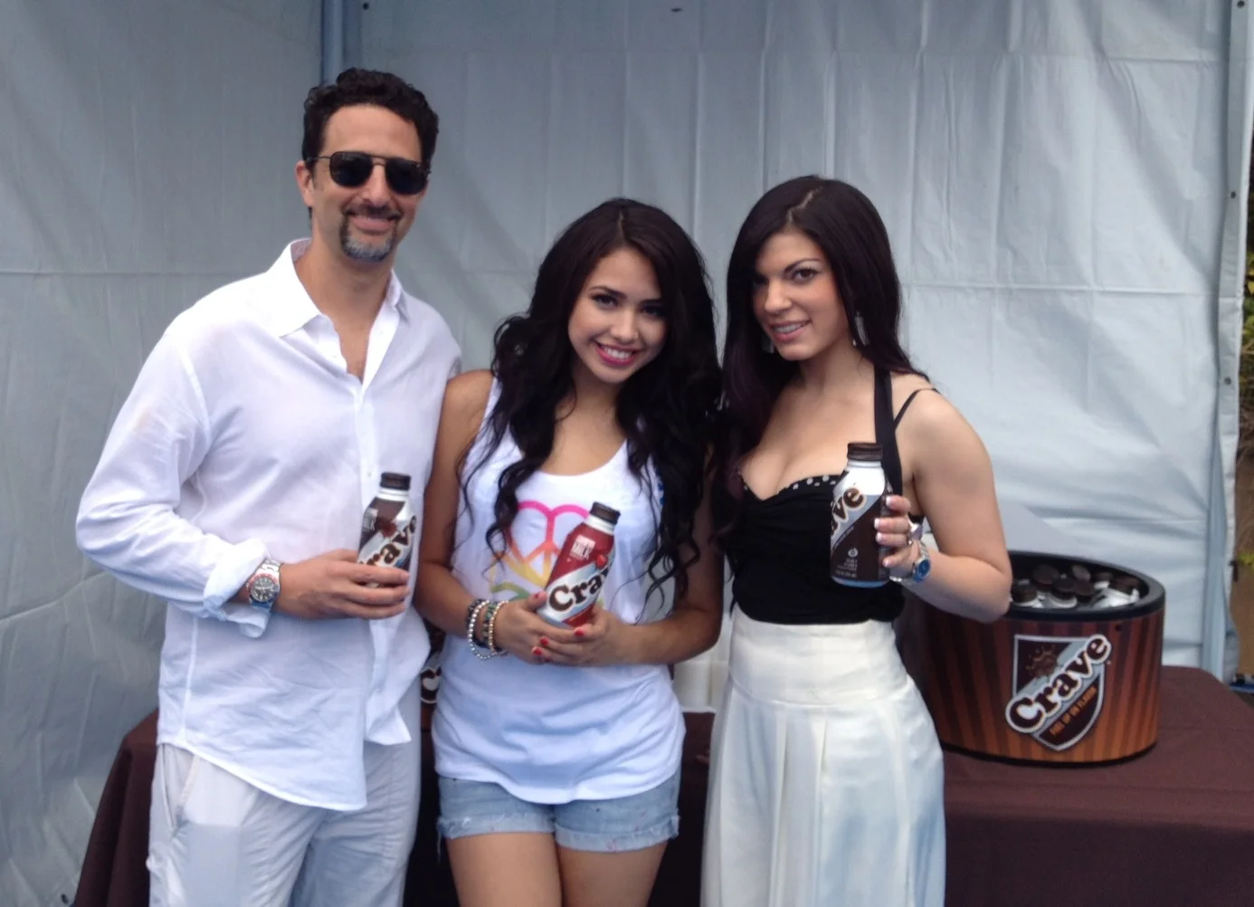 Oscar-winning producer, Grant Heslov, and teen superstars Jasmine V and Kat Lane pose with Crave Milk at the Children Mending Hearts fundraiser