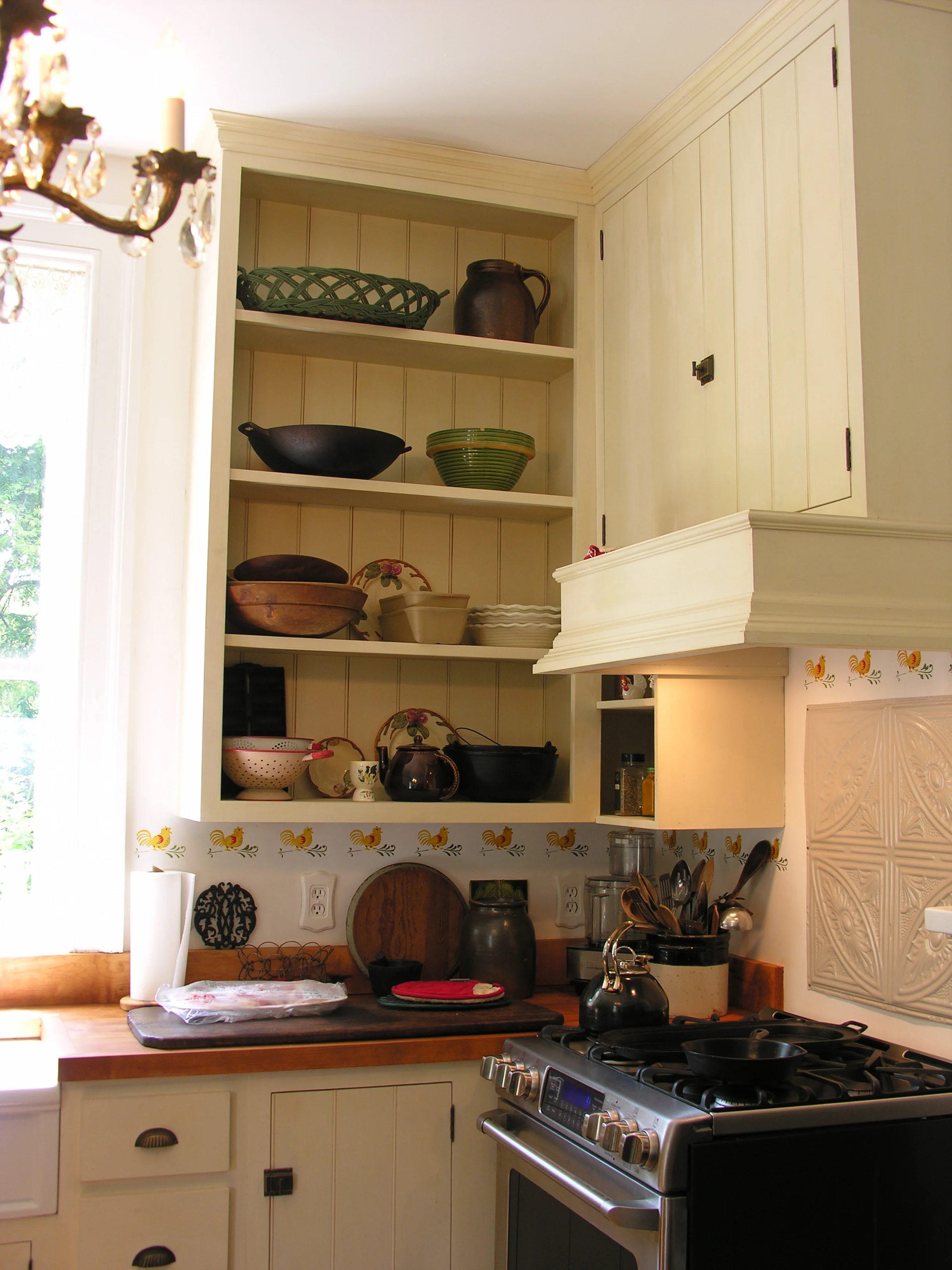  Solid poplar wood was used to make everything from the frame and doors to the custom beadboard backs. The wood is finished with a natural milk paint.    