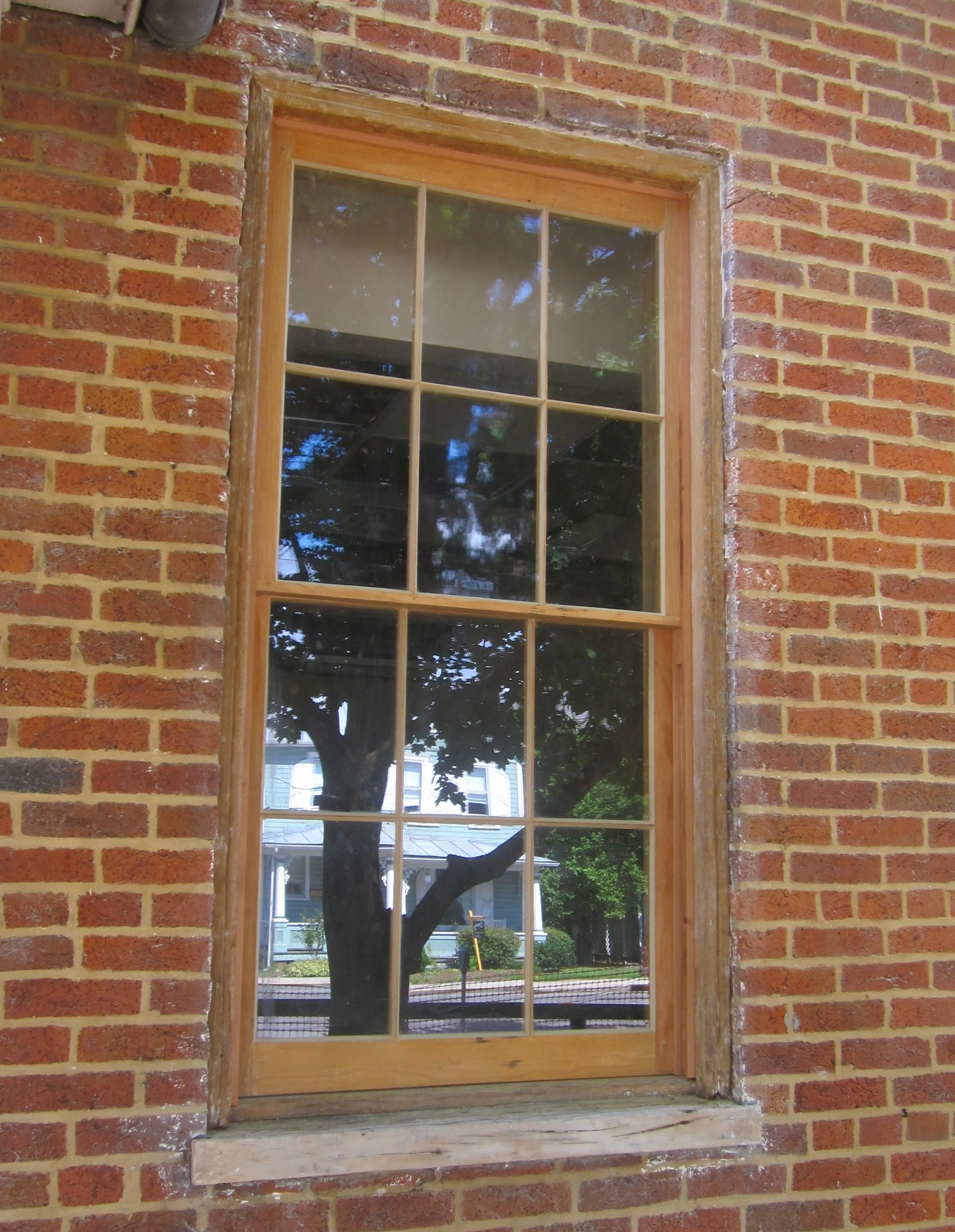   Sheriffs Building, Romney, WV   Original 1830 window openings stripped of paint, repaired and fitted with recreated sash. Weatherstripped, glazed and ready for paint.    