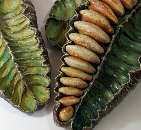 Tikal Series: Hand built from stoneware, some with hollow clay 'seeds' made to fit their space in the pod. Salt fired. Each is approximately 17"x 9"x 5"
