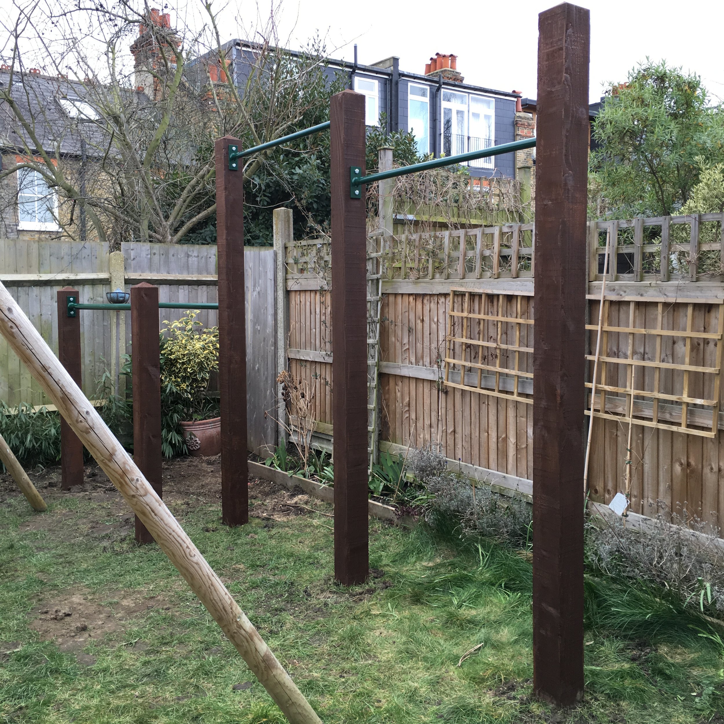 005 2016 garden double pull up bar and dip bars installation.JPG