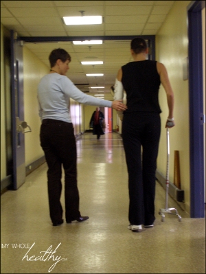 Learning to walk with a cane in the rehab hospital, my physiotherapist, Karen, guiding me.