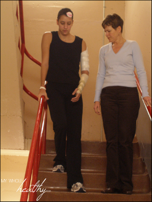 Learning to climb stairs with my right leg doing all the work. I was wearing an eyepatch when not in PT to help correct my double vision.