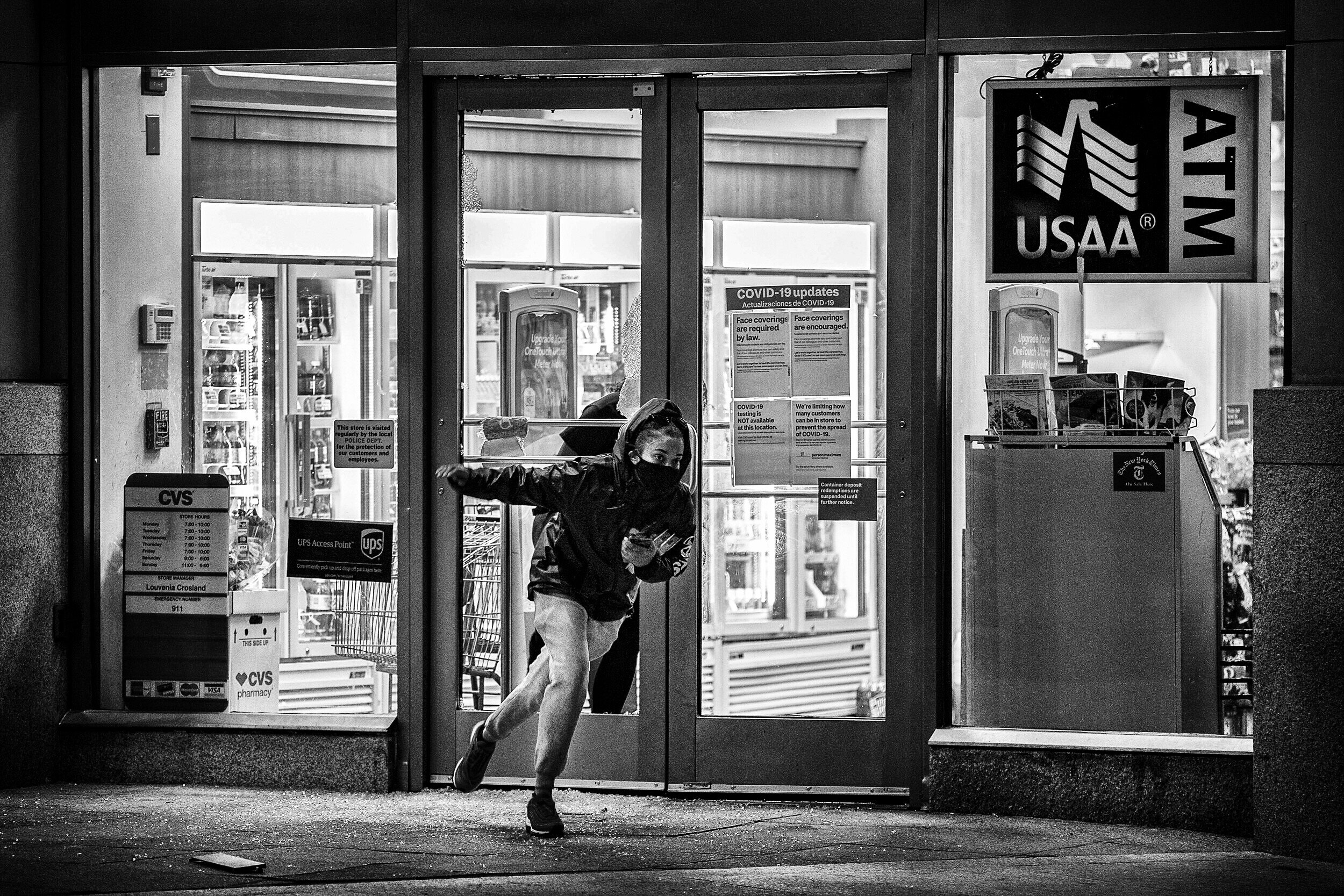 A man is seen running out of a CVS in downtown Washington, DC after demonstrators and police clashed on May 31, 2020, in Washington, DC. (Photo by Tasos Katopodis/Getty Images)