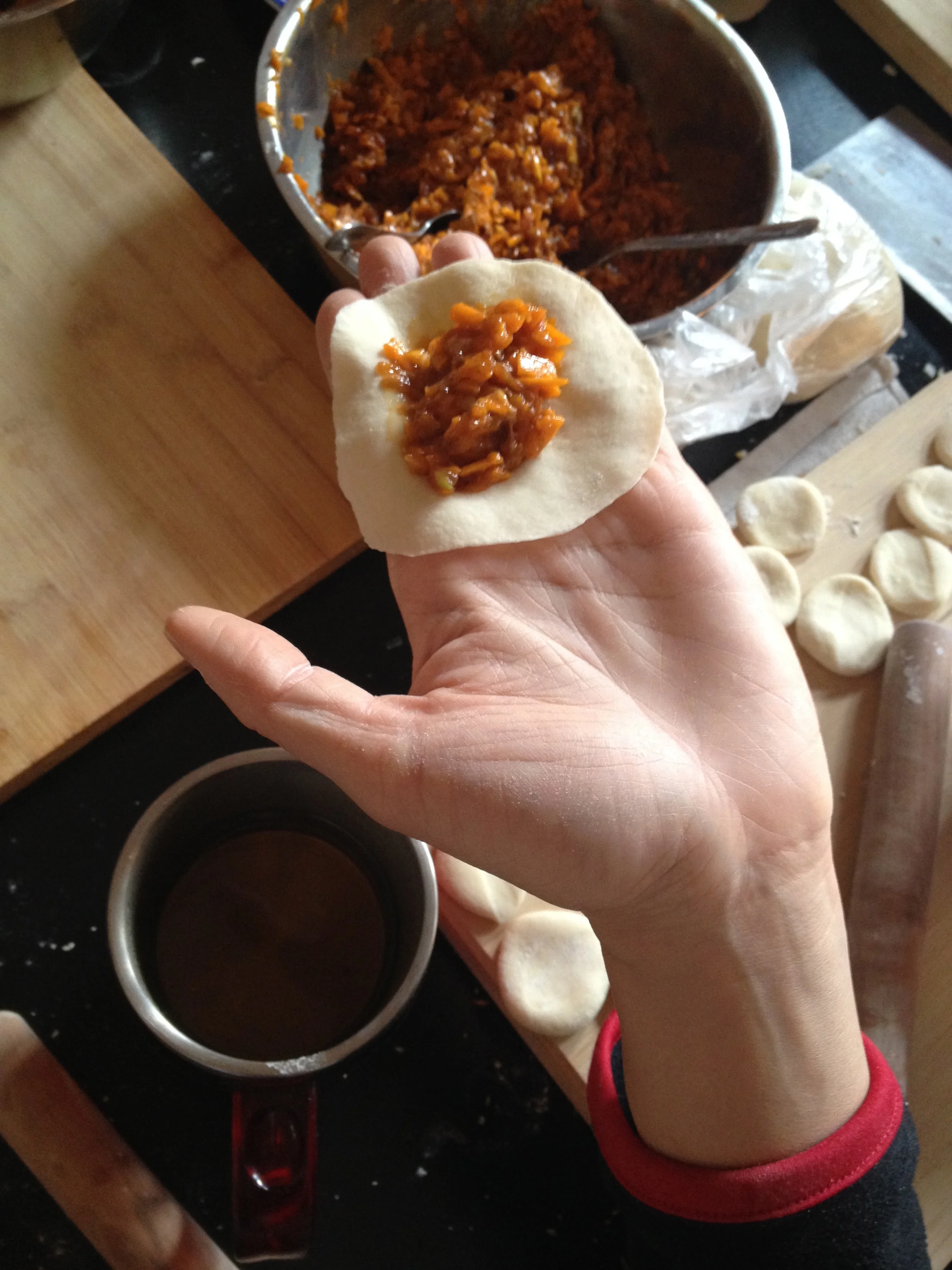 Yao showing off the pork filling in her dumpling wrapper.