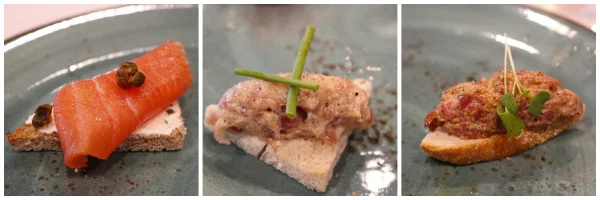  From left to right: smoked salmon with caper, tuna crostini with peppercorn aioli, and buffalo tartare with pastrami spices.