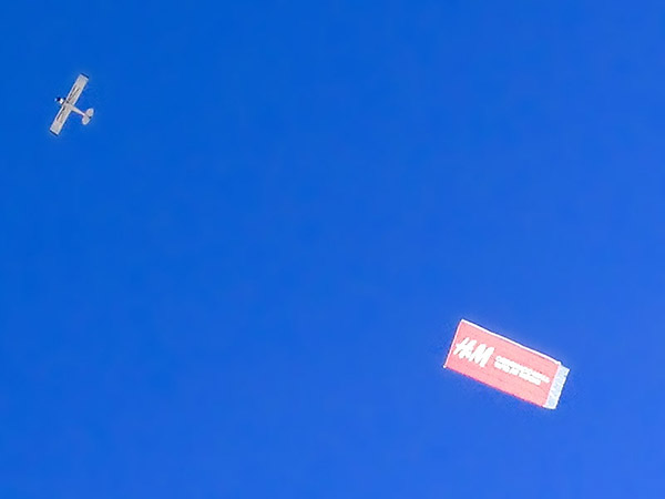 Aircraft banner advertising.