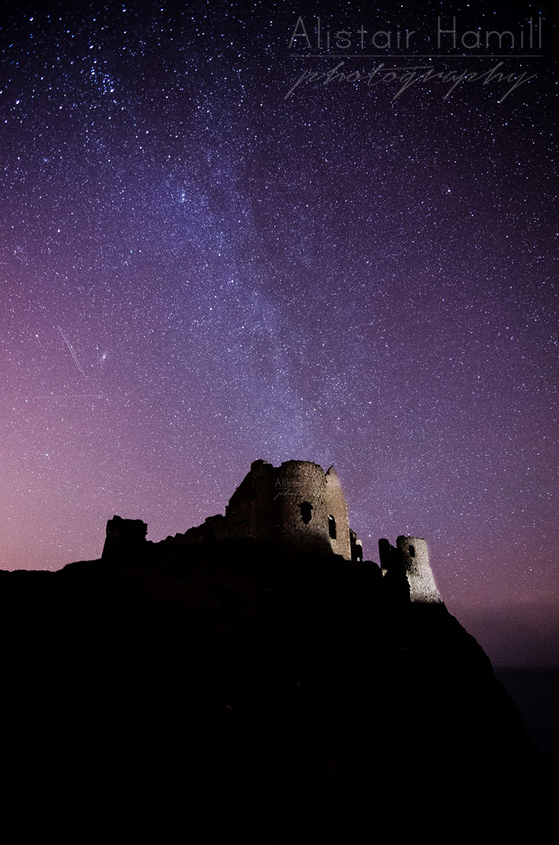 The Milky Way stretches above Dunluce - but no real aurora. Yet...