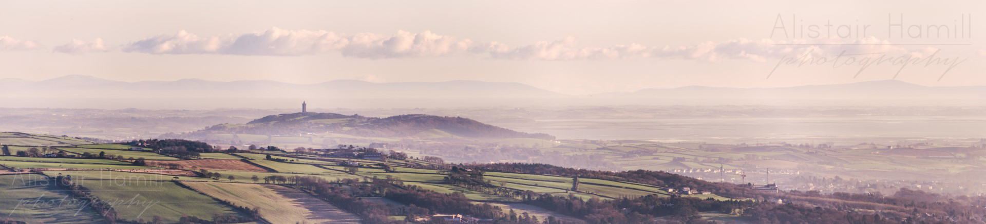 The Country of Down, draped with a light mist, as seen from the top of Cavehill