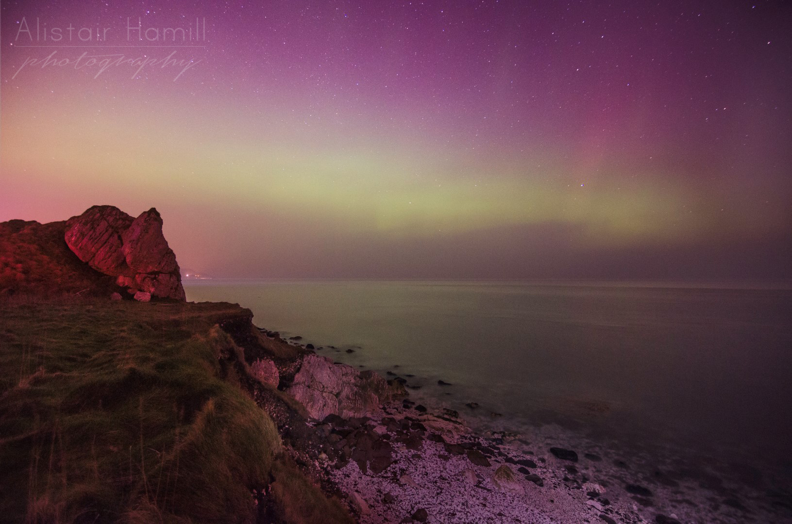 The amount of light being cast by the aurora was more than I had previously witnessed, lighting the sea and the beach before me.