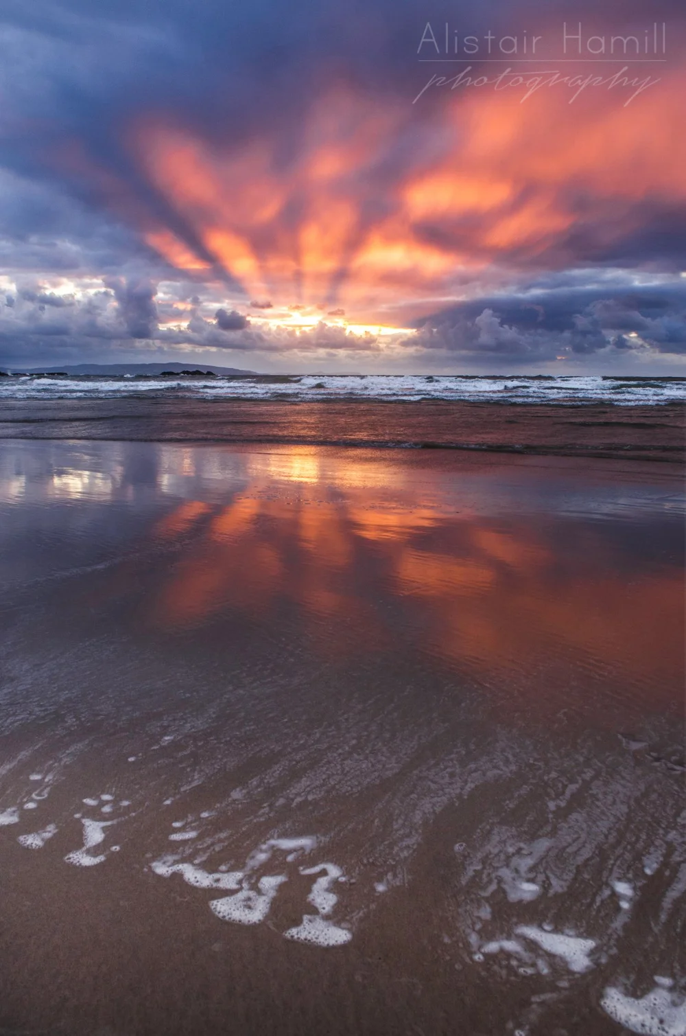 Crepuscular rays - and their reflection - at Portrush.