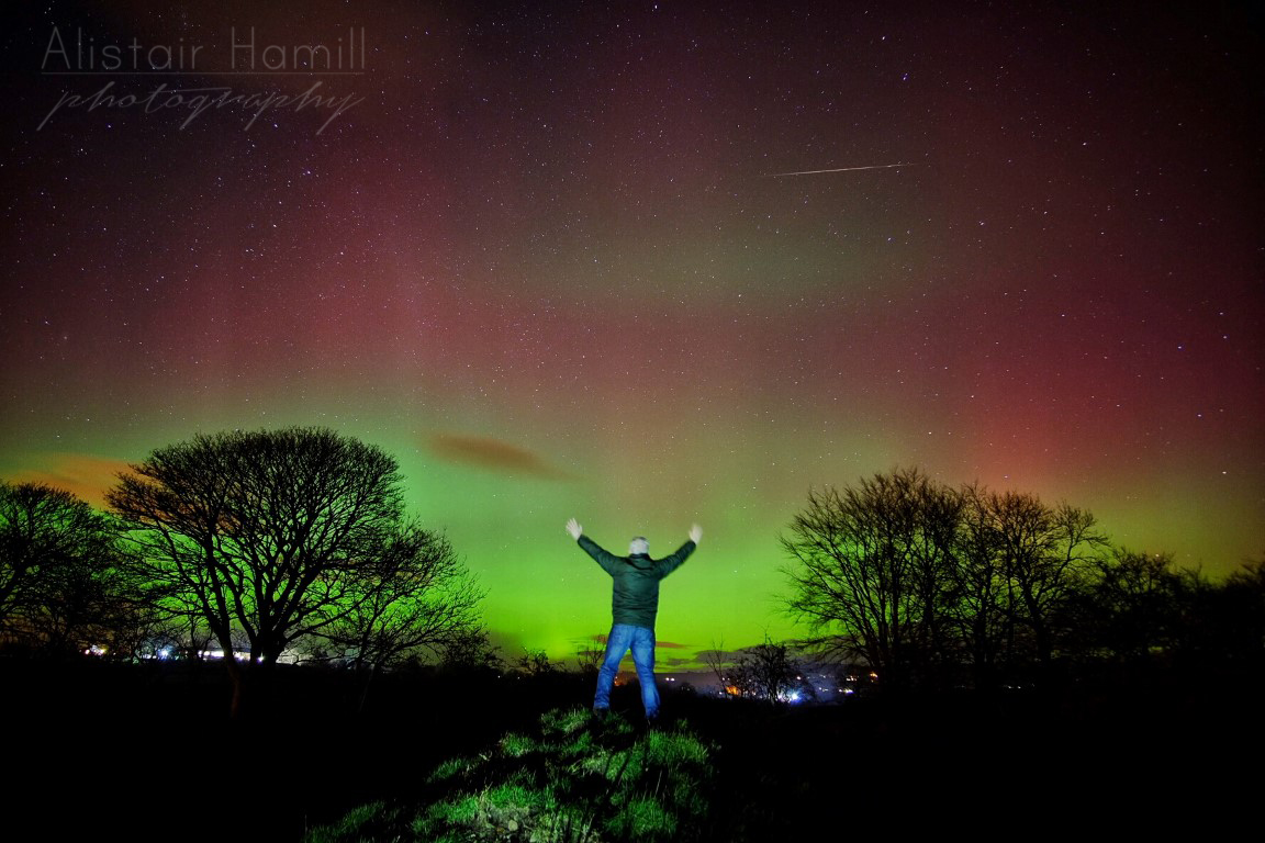 A fireball tracks across the sky whilst I am standing still for a 30 second exposure, whilst the Mother's Day aurora of 2016 dances in the sky above!