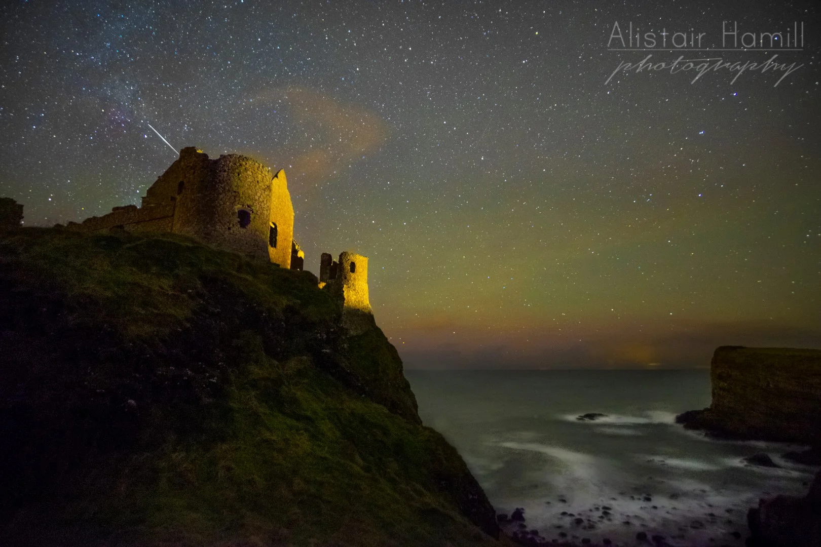 Airglow earlier that same January evening, this time behind the unmistakable outline of Dunluce Castle.