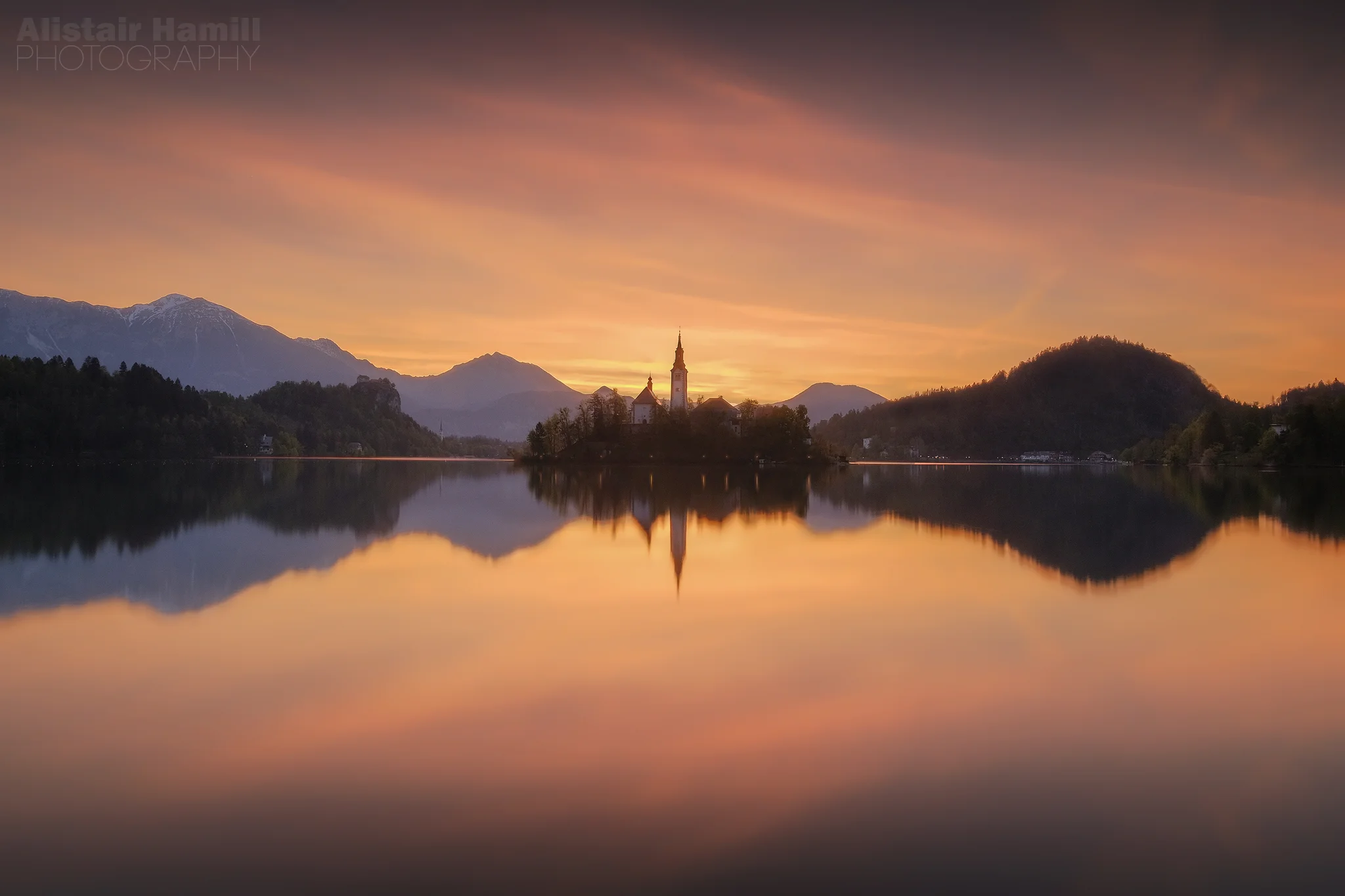 Lake Bled sunrise 1 glamor glow with lights (large) WM.jpg