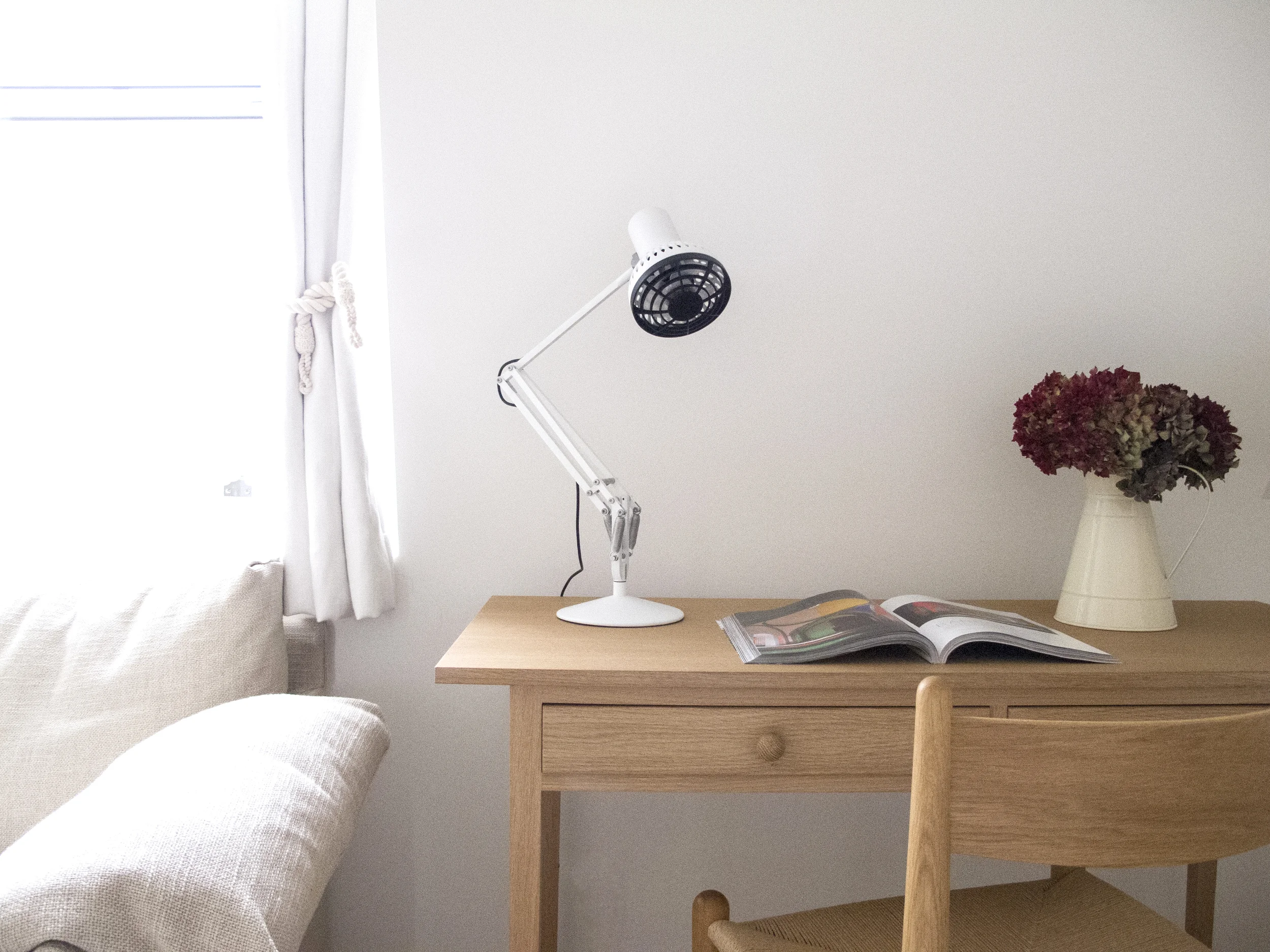 But, by taking the lamp directly to the area of activity an Anglepoise could use a much lower wattage bulb.