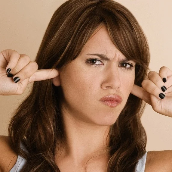 947646-child-fingers-in-ear.jpg