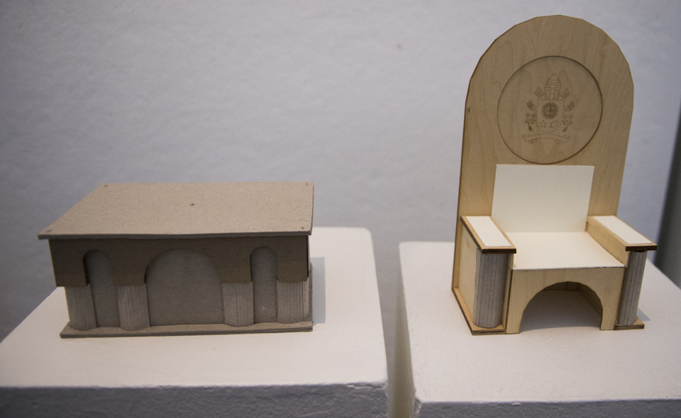 The first-place design features arches that mimic the architecture of the Romanesque-Byzantine style Basilica. The chair designed for the Pope features a simple high arch “designed to bring focus not on itself, but on the Vicar of Christ himself who will preach from it,” the team stated in their concept. Members of the winning design team include architecture students Ariadne Cerritelli (Bethesda, Md.), Matthew Hoffman (Pittsburgh), and Joseph Taylor (Eldersburg, Md.).