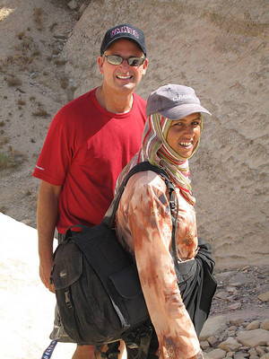 Mark with Saba carrying his camera bag