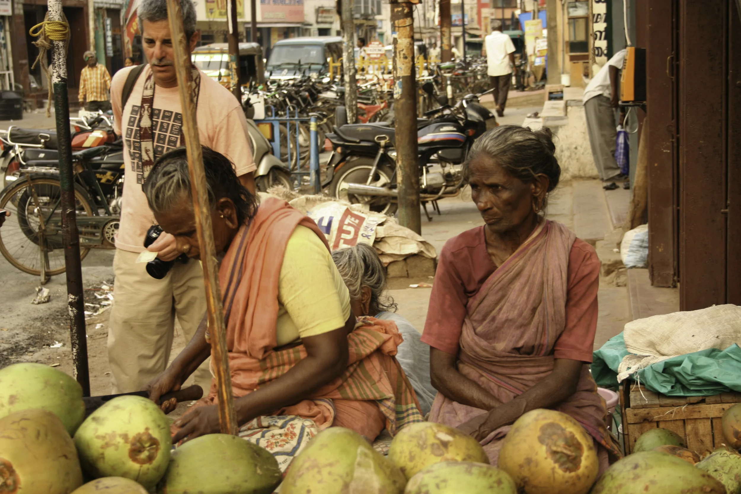 Cliff buying a coconut&nbsp;on the streets of Madurai