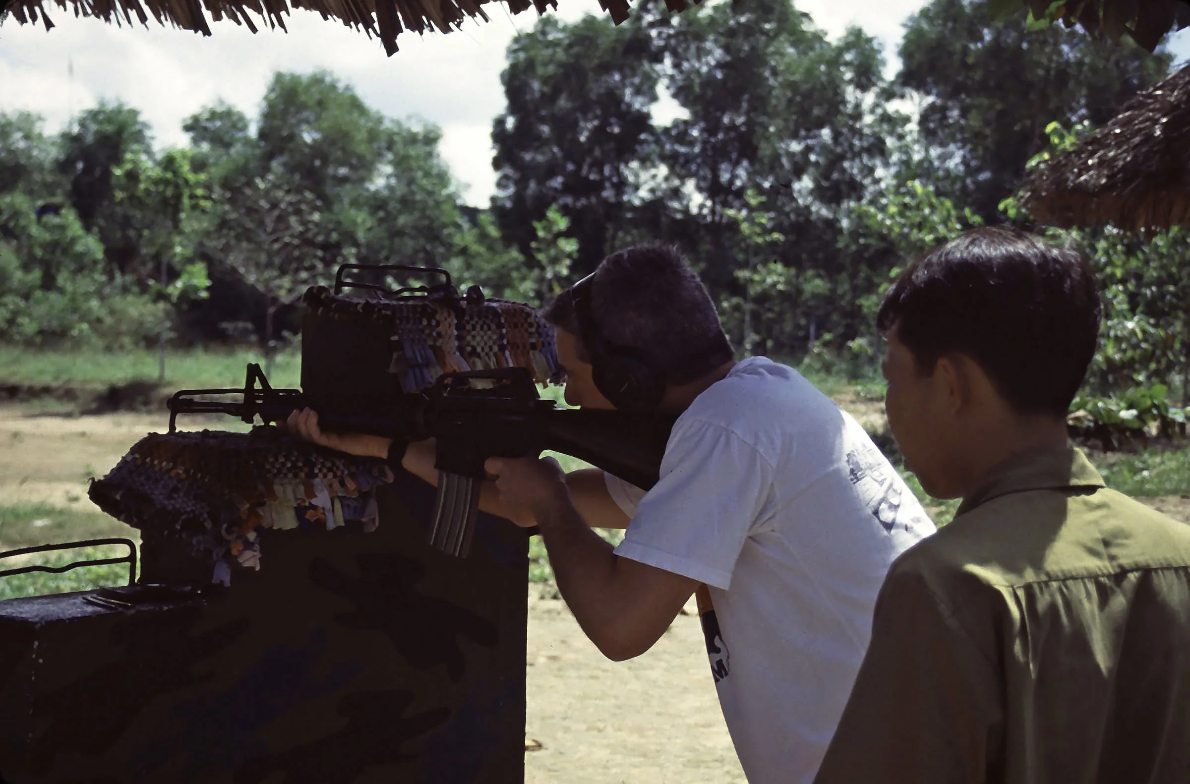 Cliff firing a Vietnam era weapon at the shooting range at the War Memorial Park