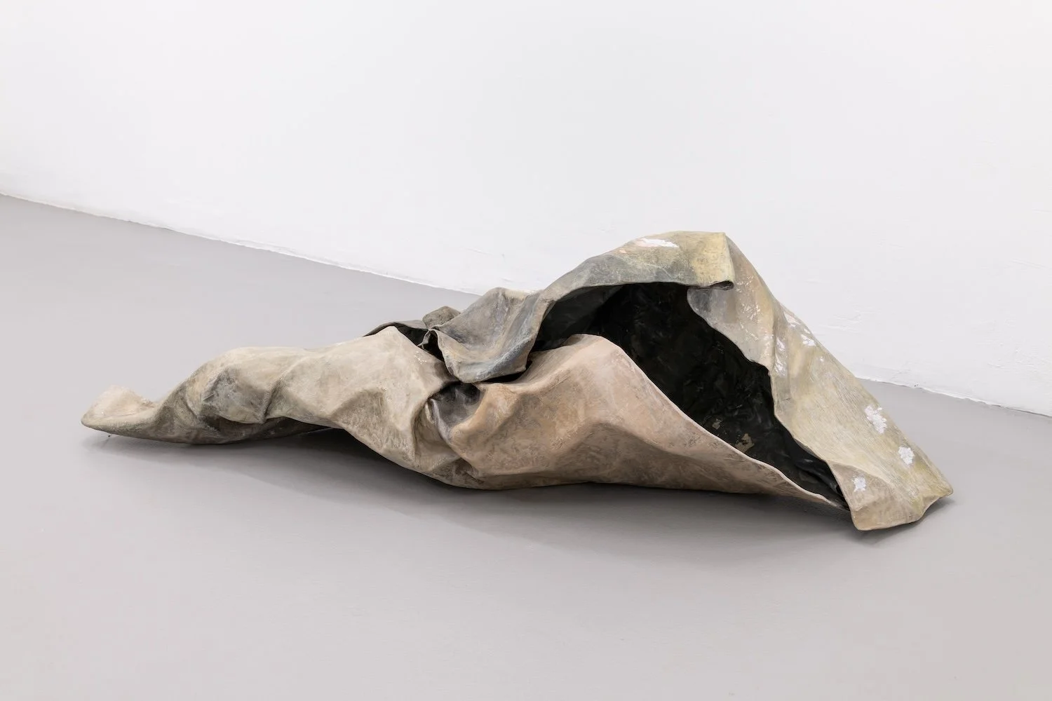 Traces, 2022, papier-mâché, gesso, ink, colored pencil, graphite, and acrylic paint, 14 x 20 x 50 inches
