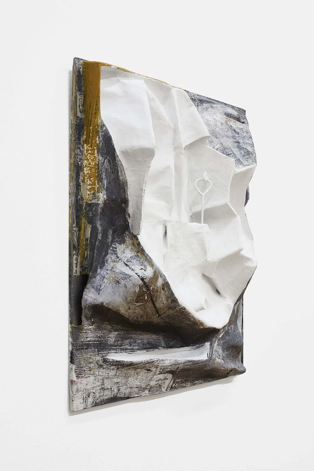 Mending Wall, 2017, papier-mâché, plaster, hooks, collage and paint, 22 1/2 x 22 1/2 x 4 inches