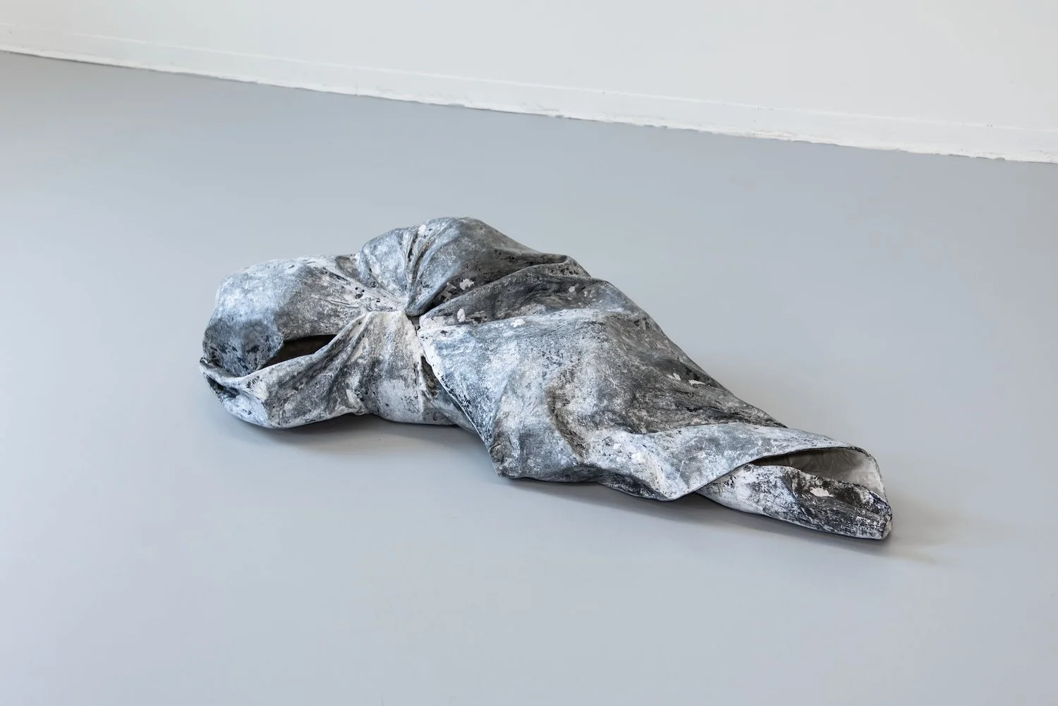 Vanishing Point, 2024, Ink, acrylic, graphite, aqua resin, and papier-mâché, 11 x 44 x 16 inches