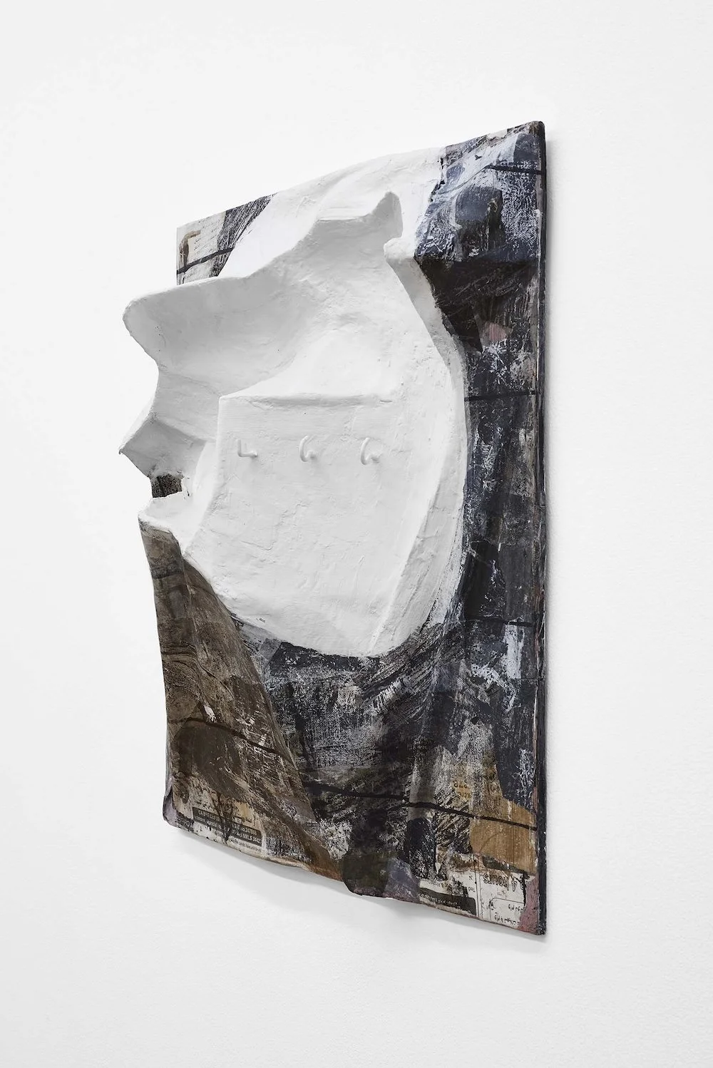 Opened Facade, 2017, papier-mâché, plaster, hooks, collage and paint, 22 1/2 x 22 1/2 x 6 1/2 inches