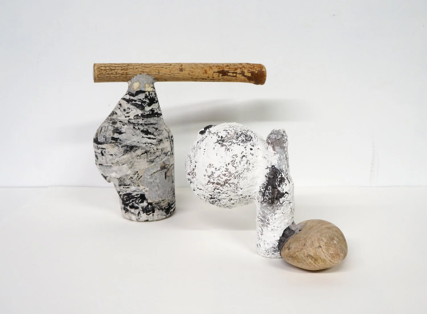 Untitled Vessels, 2017, papier-mâché, rock, wood, and found objects