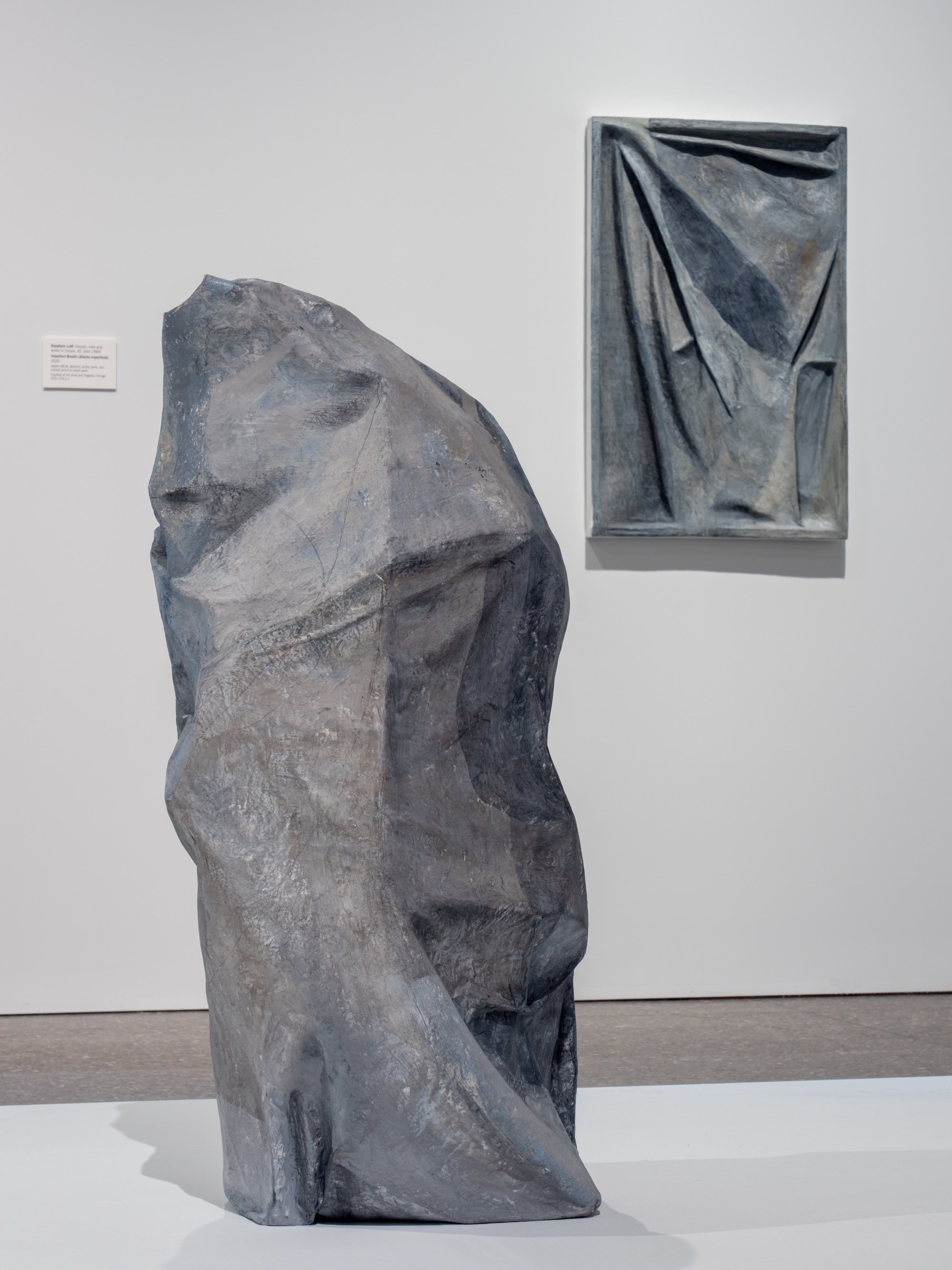 Concealed, 2020, papier-mâché, graphite, and acrylic paint, 42 x 19 x 16 inches 
