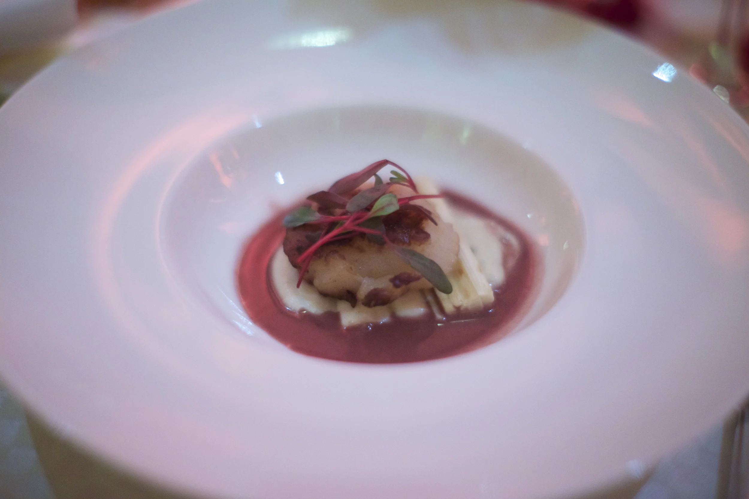 Next up was the official 1st course of the meal. I'm a sucker for a good scallop, so I was particularly excited about this coarse. Unfortunately it didn't come through as much as I hoped it to. The scallop was properly seared, but surprisingly just a tad undercooked. The salsify puree was a nice touch with it's earthy flavor and silky smooth texture. The heart of palm was fresh, sweet, and meaty. The sauce was sweet/tart, buttery, and had a floral essence to it. I'm assuming it was the "Hibiscus Foam" and again I was missing the "Foam" effect on this one. As far as the "White Chocolate Beurre Blanc" went, I didn't even realize it was a part of the dish until I glanced at the menu again. I just couldn't find it on the plate! All in all this was a decent 1st coarse, conceptually speaking. Here's how the menu read: -Course 1- Scallop with Heart of Palm Salsify Puree/ Hibiscus Foam/ White Chocolate Beurre Blanc 