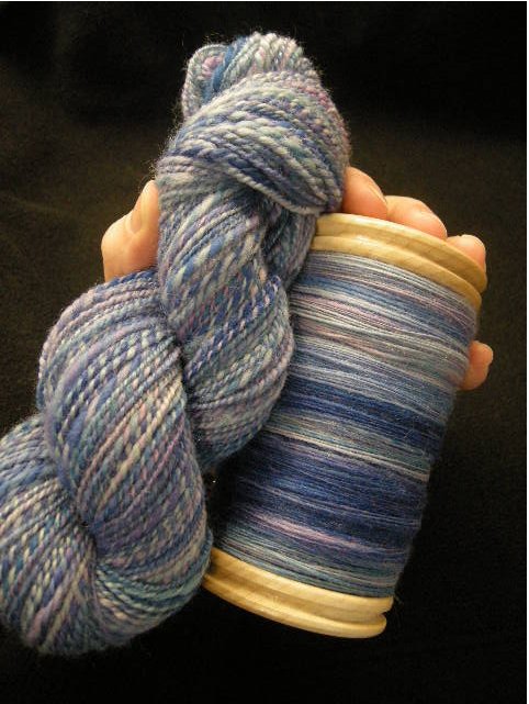 "Nina": 2-ply Corriedale, 14 wpi, with my first full bobbin, yardage TBD.
