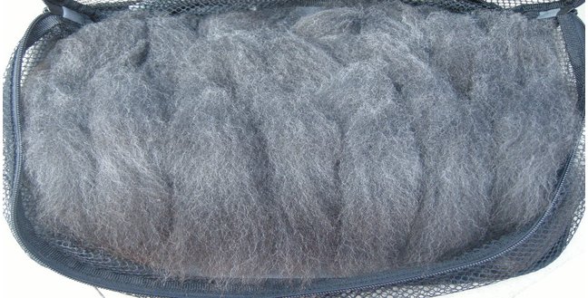 Aren't these just the cutest little locks, waiting to be spun? The look like little fiber creatures. I shall call them Wooly-Blobs. And they shall be my friends.