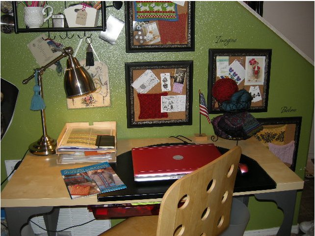 Here's a closer look at my desk. Swatches, postcards, buttons I love, and other inspirational ephemera are all here in a rotating display that keeps me inspired, or at least tenacious. In the foreground is some artwork from my book, The New Stranded Colorwork