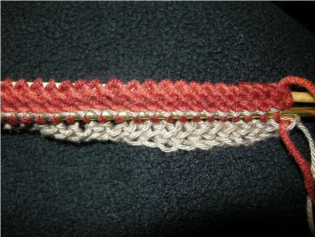 All the purl bumps are now stitches on the finer needle (below). Original needle is still in place (top).