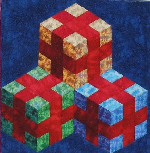 Patchwork Illusions quilt – STACKED AND WRAPPED By Karen Combs