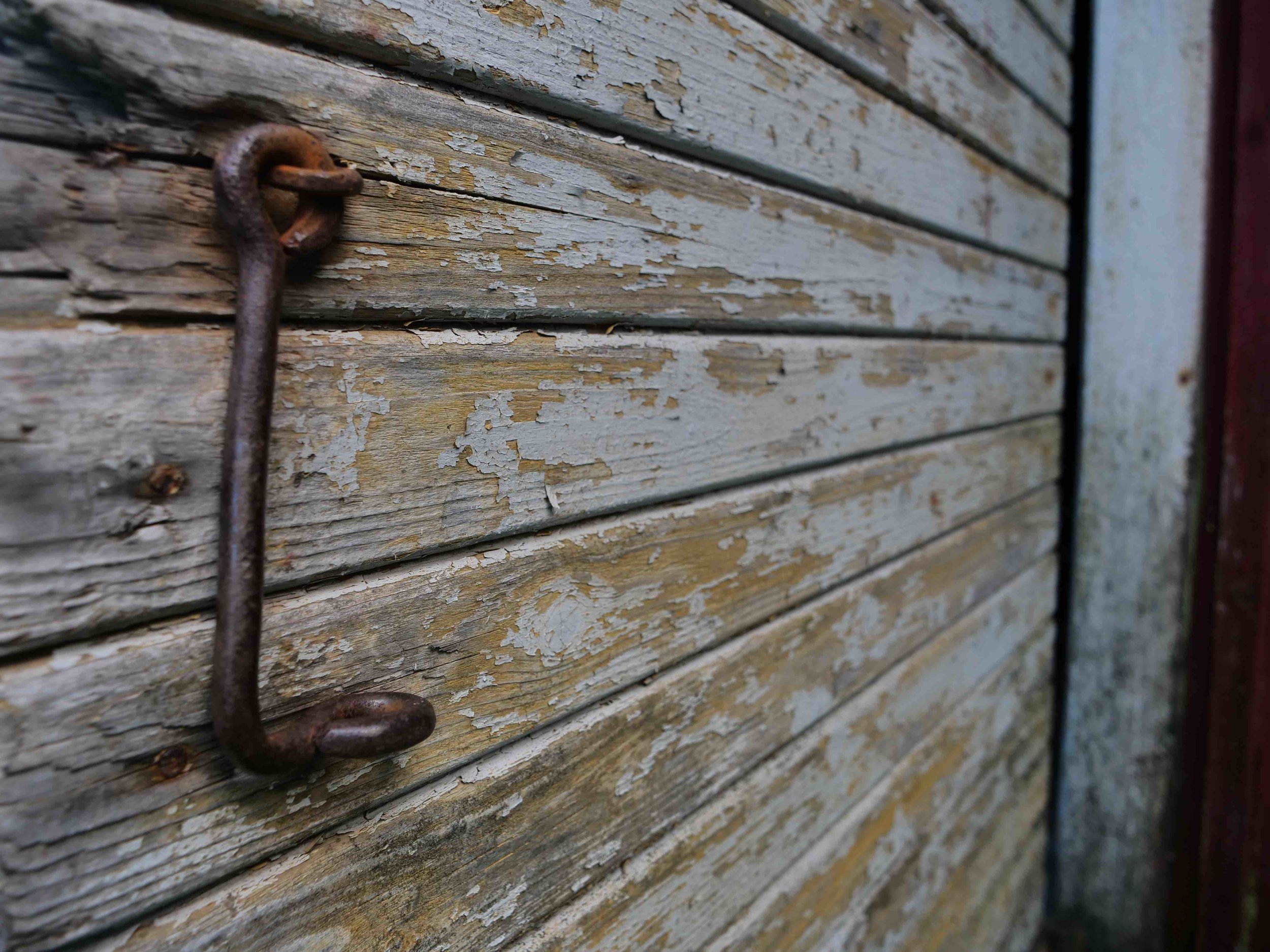 Old iron and wood on the barn house. 