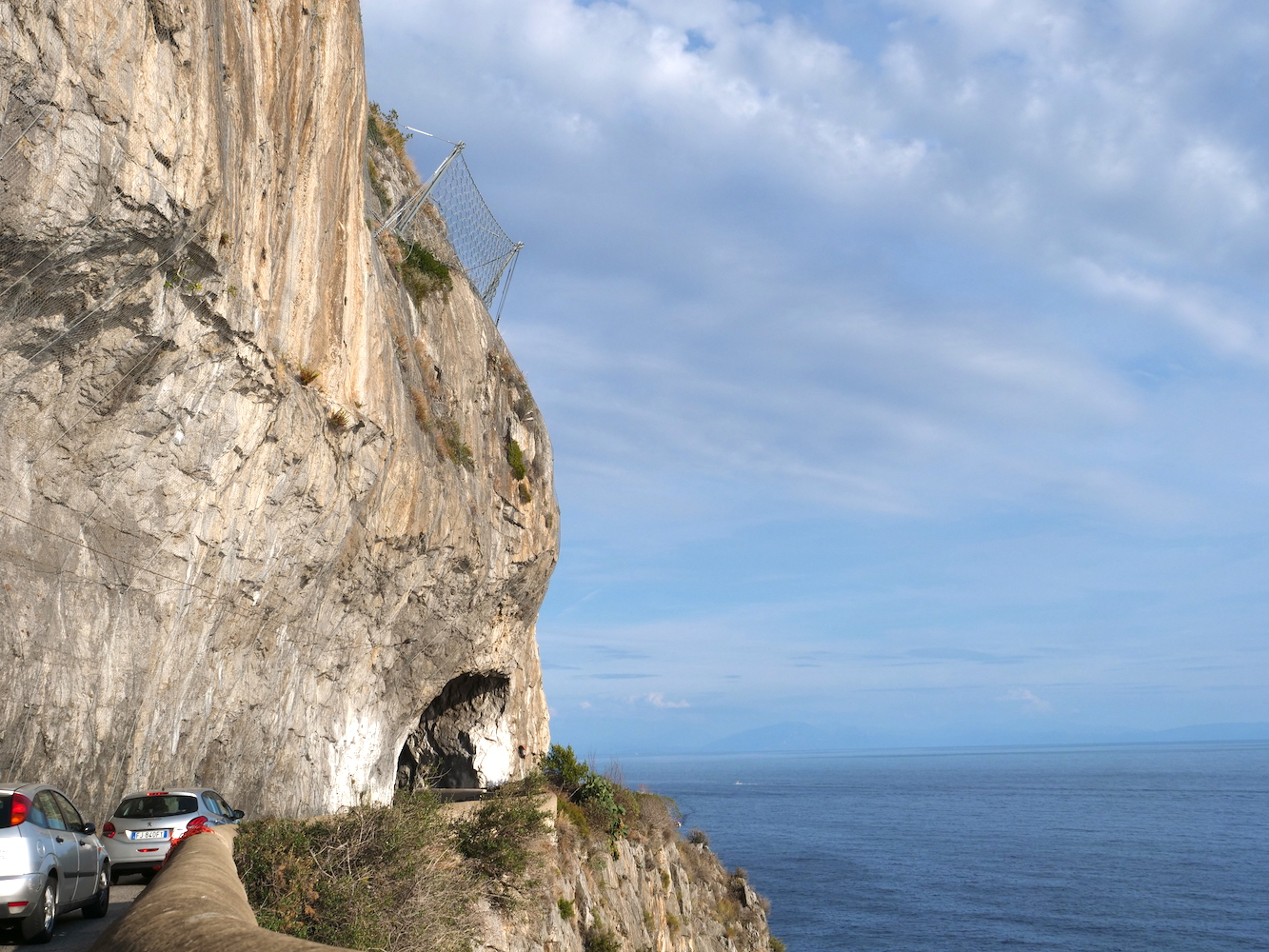 Cutting into a cliffside tunnel on the Amalfi Coast.
