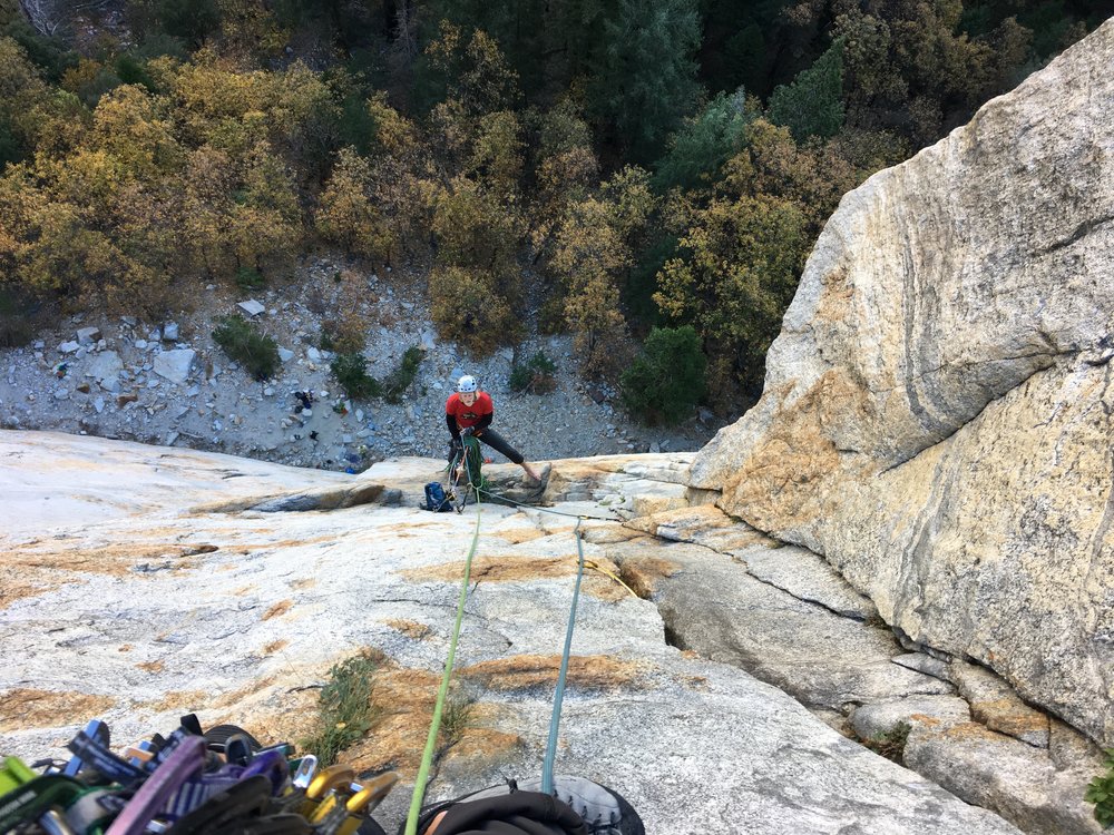 Getting a belay from Will. We used all my ropes and gear because he traveled light. His only climbing gear were his shoes, helmet harness and chalk bag. You can do that?!