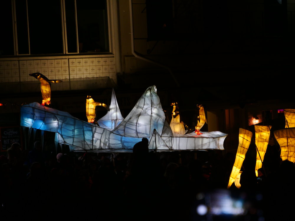 Icebergs and penguins make their way around the center of Dunedin in the Midwinter parade.