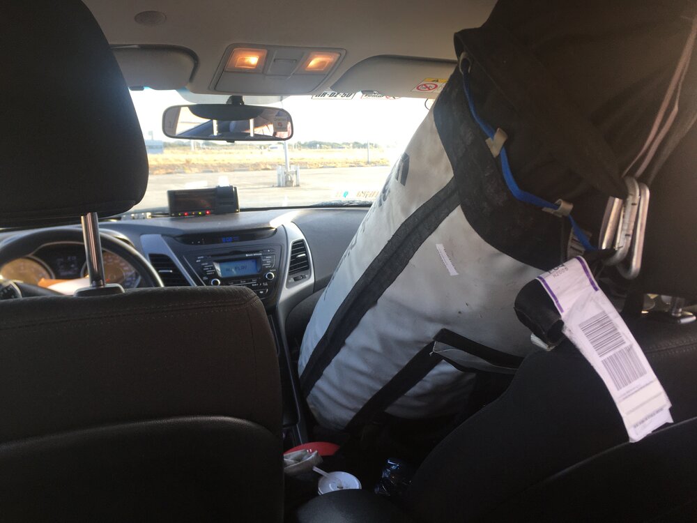 Our haul bag in the front seat of the taxi.