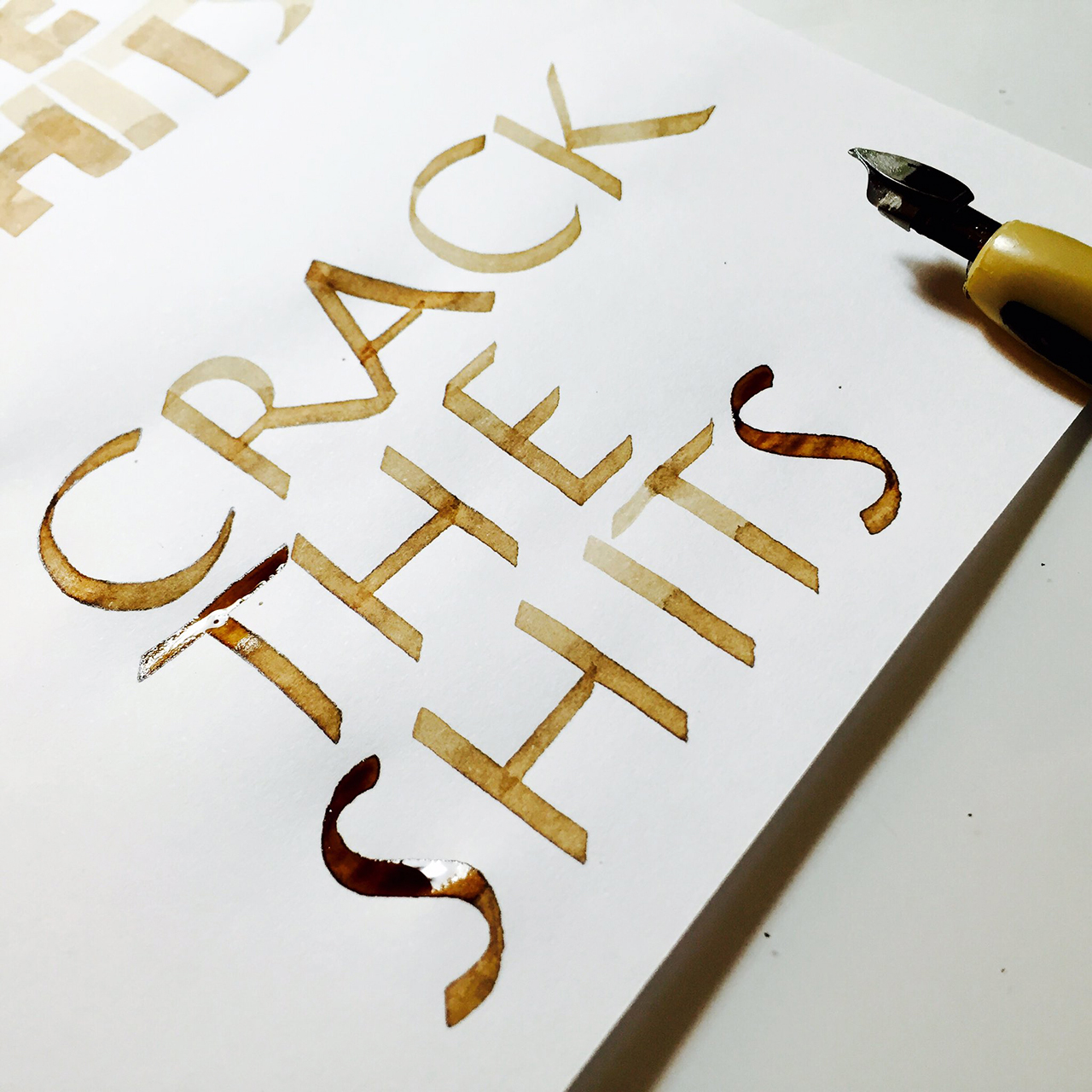 Post number #32: “Crack the shits” thanks to the contribution of Kate Pullen . Roman Capitals calligraphy.