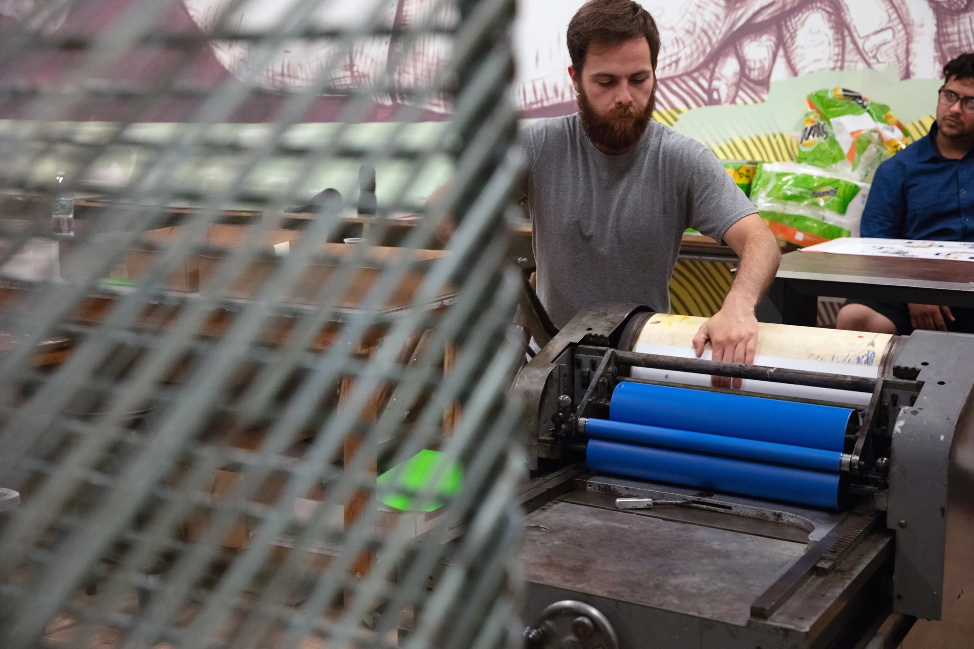 DONALD PRINTING, Photo by Anthony Alvarez To pull off the production of the book, we knew that we were going to need help running two presses and that the total printing process would take months (it was 7 in total) to complete. We also recognized that it was a unique educational opportunity we could provide, so we enlisted a small army of design students from both Pace University-NYC where I teach, and Rutgers-Newark where Ned teaches. Opening the experience to students was something we both felt was an important opportunity—most of our collaborations focus on the educational value and merits of immersive creative processes as a learning tool.